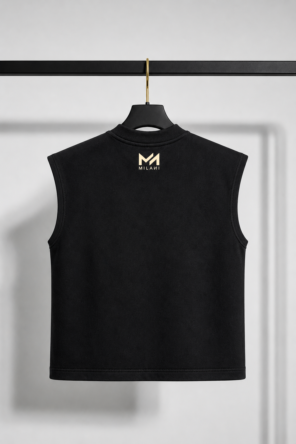 Black sleeveless shirt with a logo on a hanger against a white background